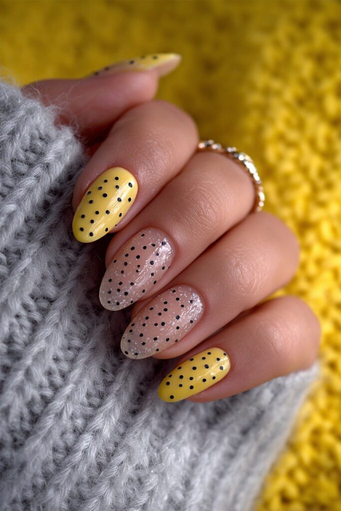 Playful jelly nails with translucent texture and floating black polka dot design.