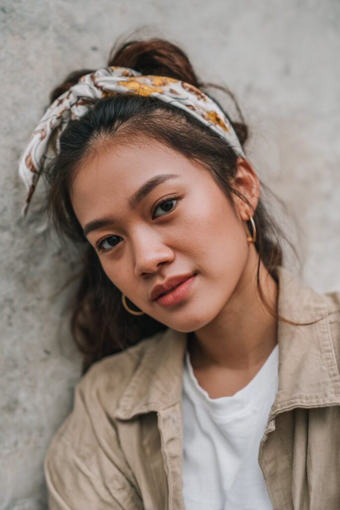 Soft half-up half-down hairstyle tied with a colorful patterned scarf headband – Headband Hairstyles series.