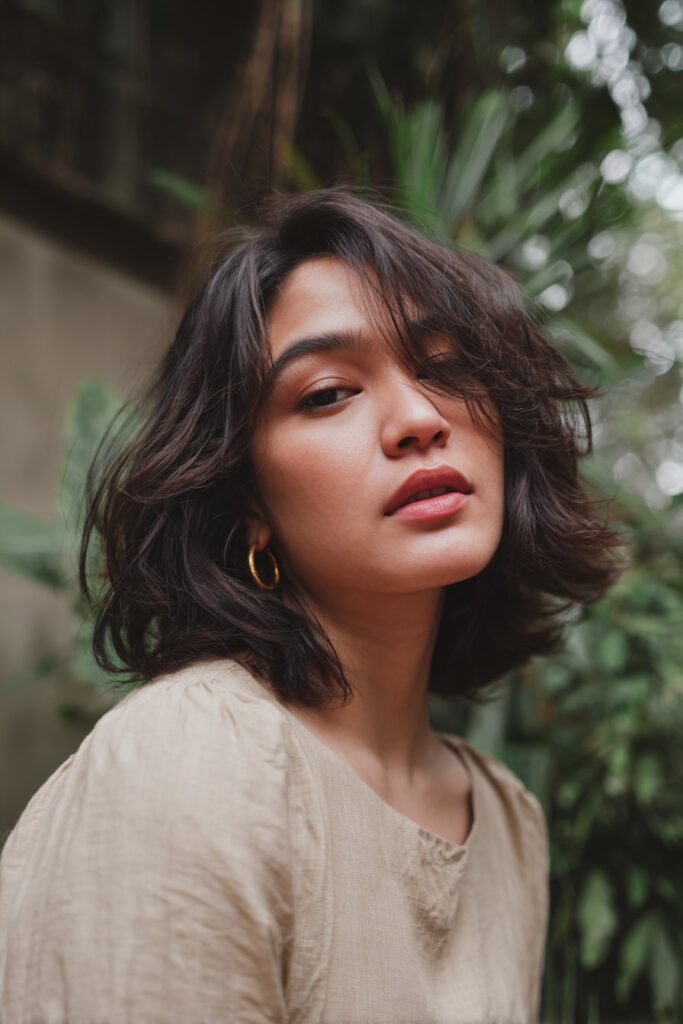 A short layered bob choppy haircut designed specifically for thick hair. The strategic layers remove bulk while the choppy ends add freshness, helping the style appear lighter, more defined, and full of shape.