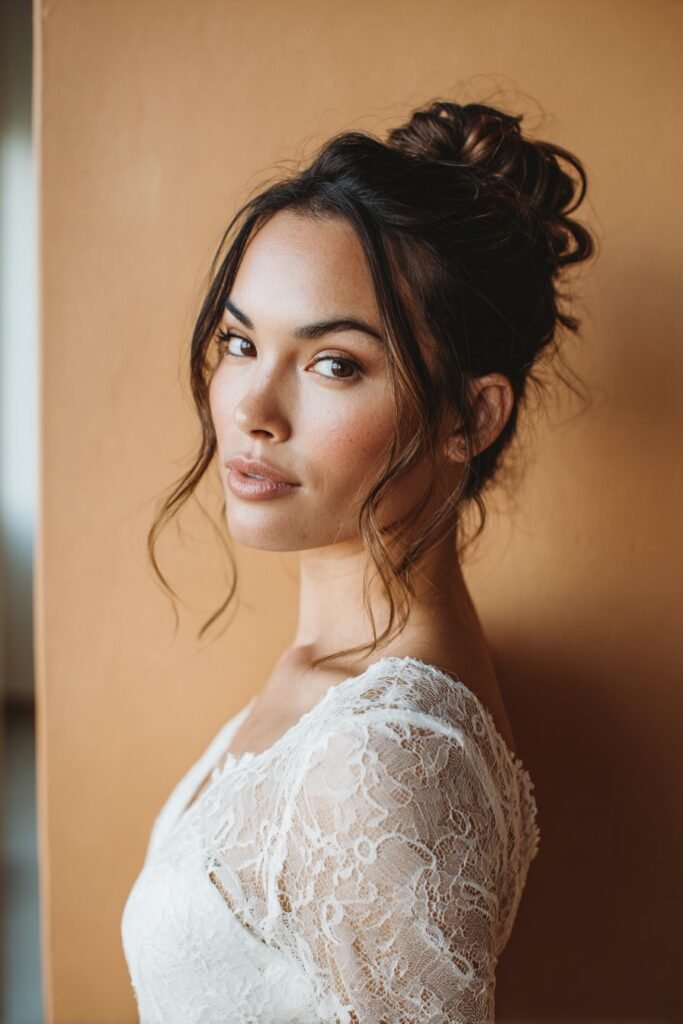 Thin fine hair arranged into a twisted knot bun with delicate twists creating volume, photographed in a clean wedding-inspired background.