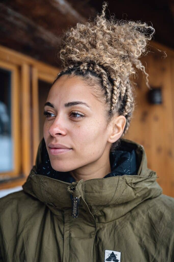 Braided crown bun styled on curly hair for skiing