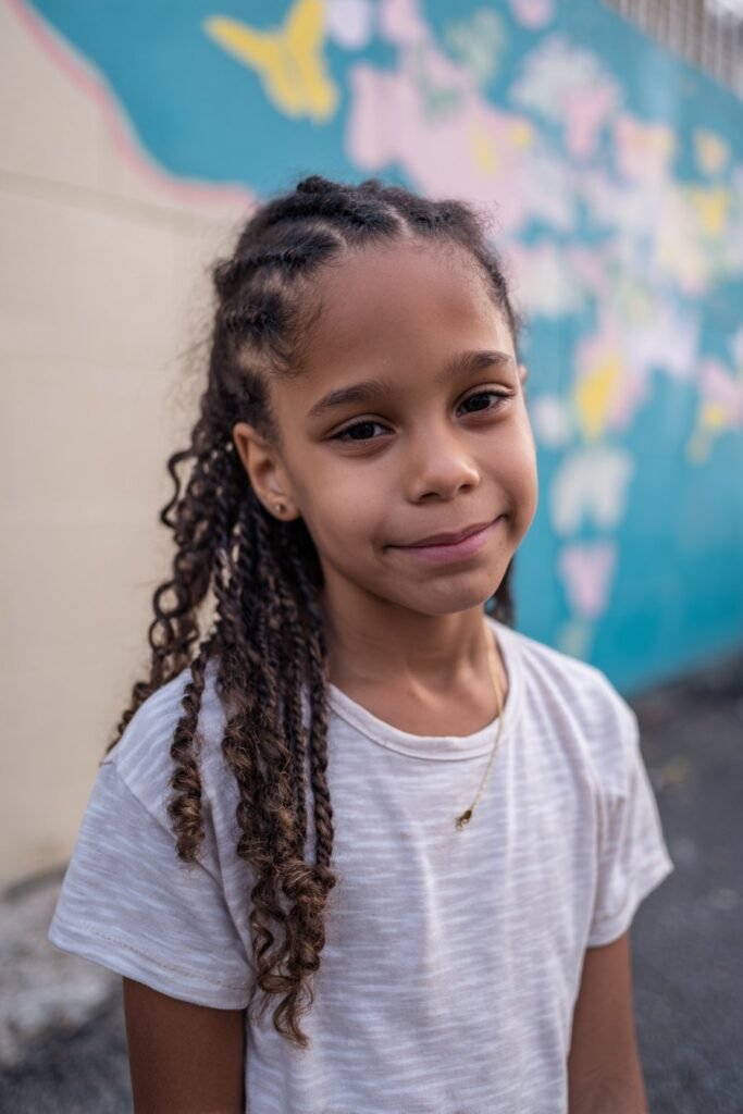 Butterfly wing cornrows curly kids hairstyle