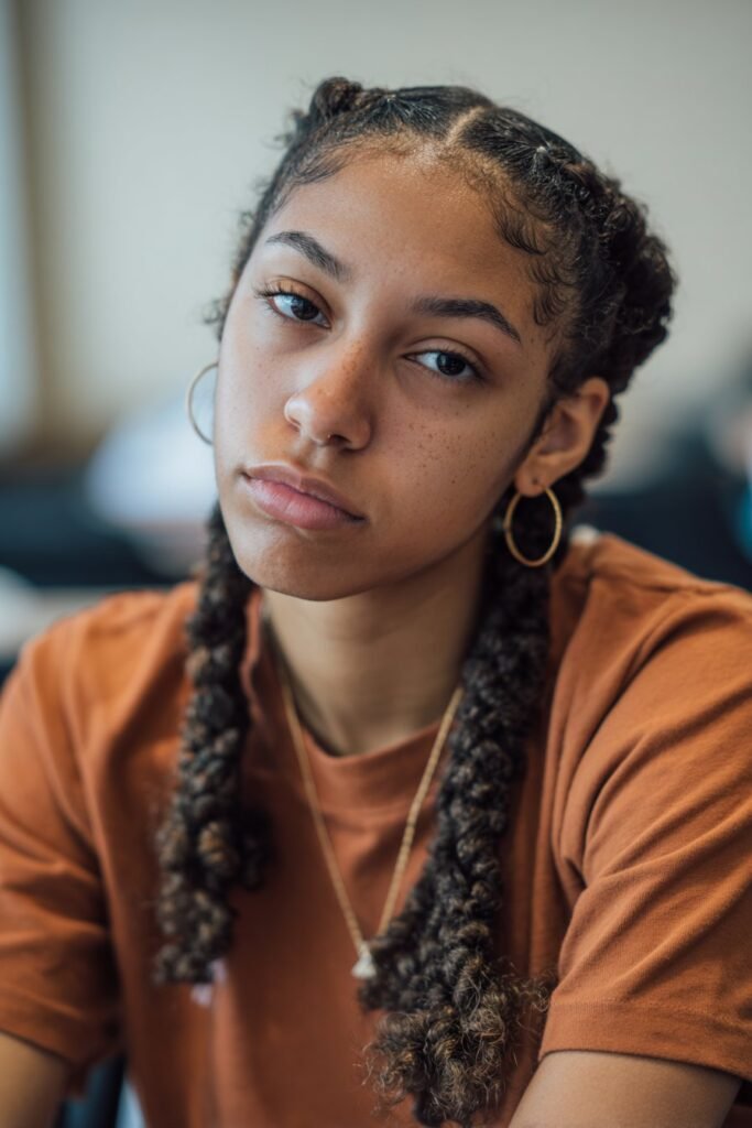 student with chunky flat twists and curly ends