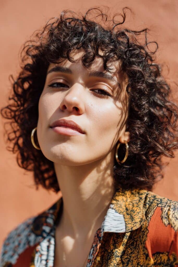 curly bixie haircut with defined curls