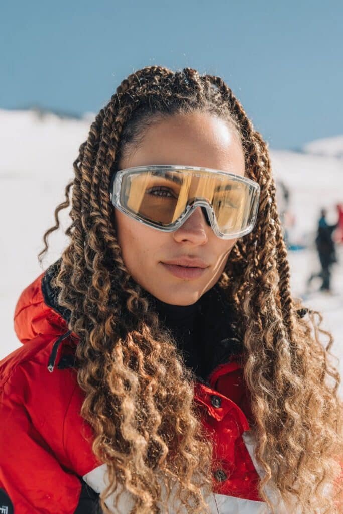 Dutch braids styled neatly on curly hair for skiing