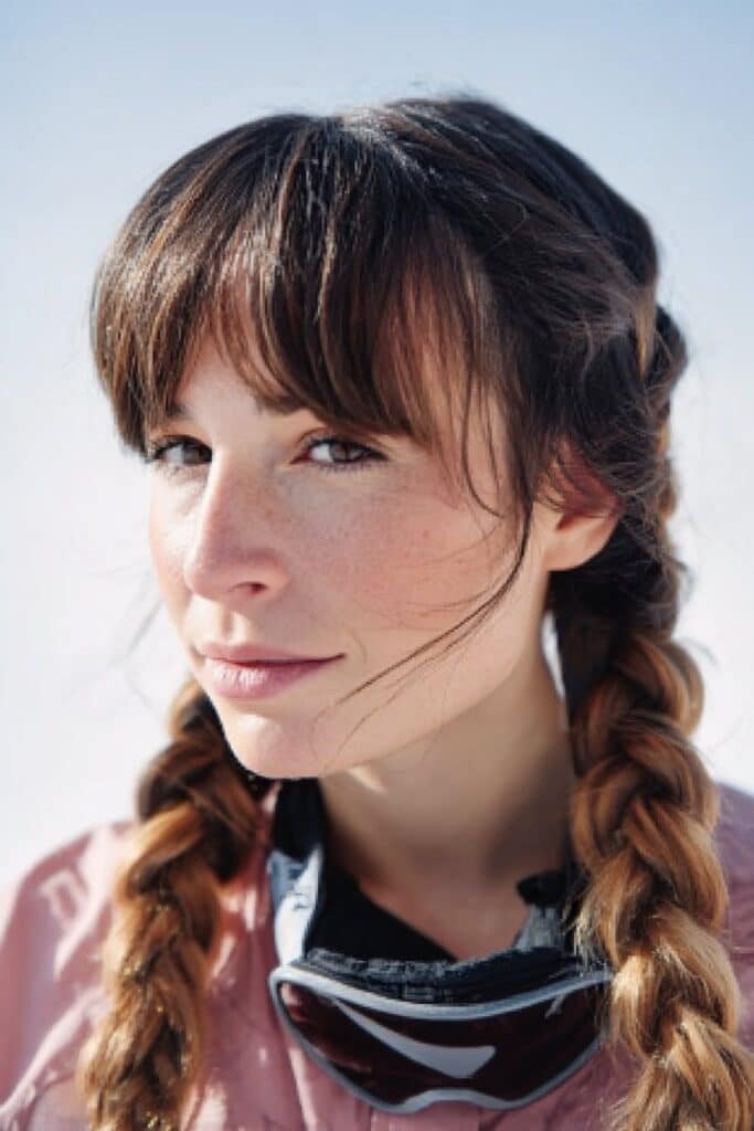 French braids snowboarding hairstyle with side swept bangs