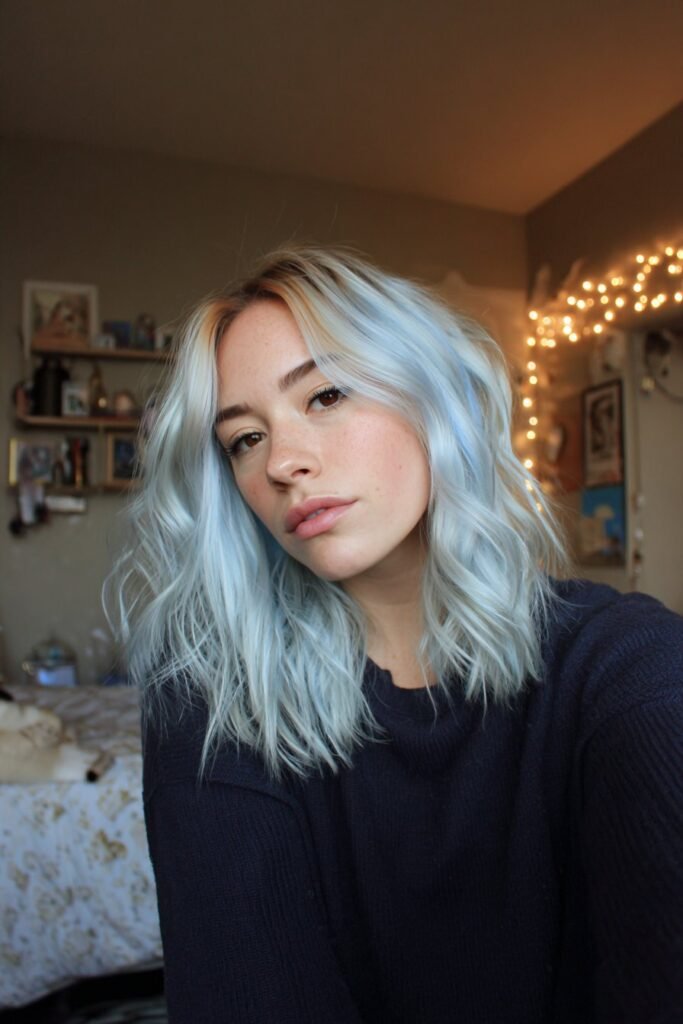 soft waves with pastel baby blue peekaboo highlights hidden beneath hair