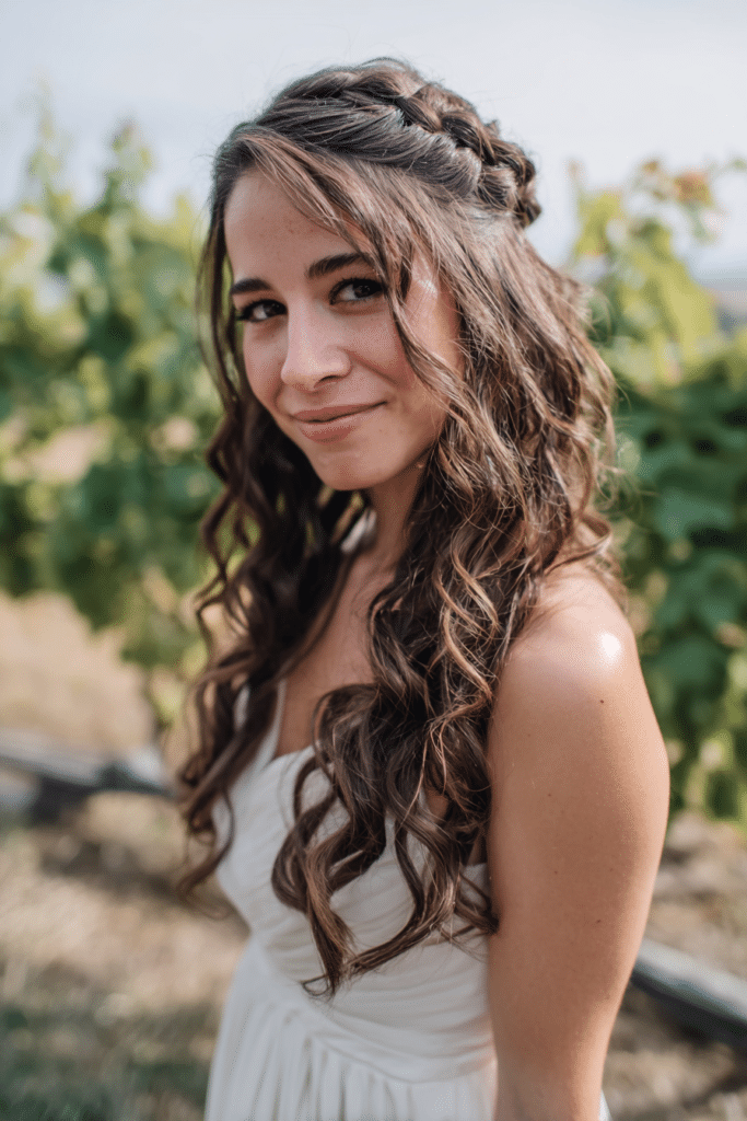 Romantic side waterfall braid hairstyle for bridesmaids with flowing strands