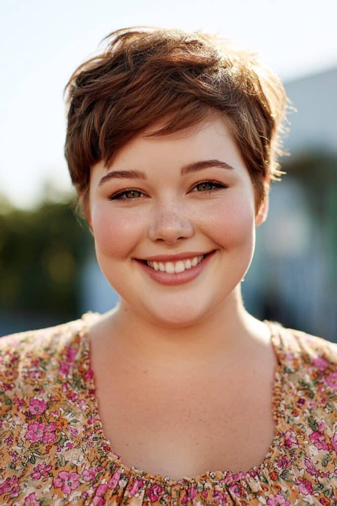 textured pixie with side bangs on a young plus size woman