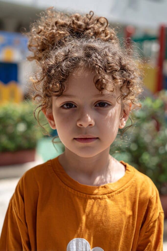 Cloudberry puff curly kids hairstyle with soft rounded curls