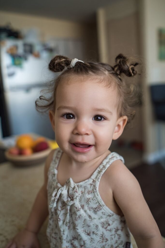 infant baby girl hairstyle with tiny braided knots