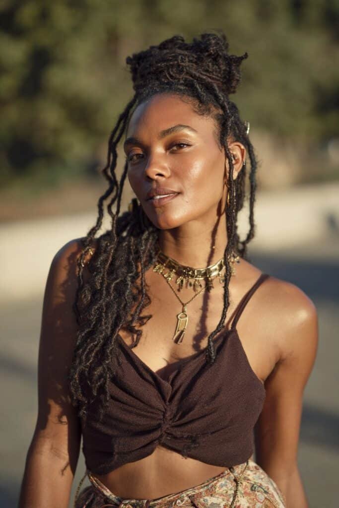 woman with twist loc style and loose locs