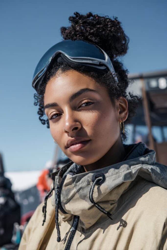 Twisted high bun ski hairstyle with natural curls