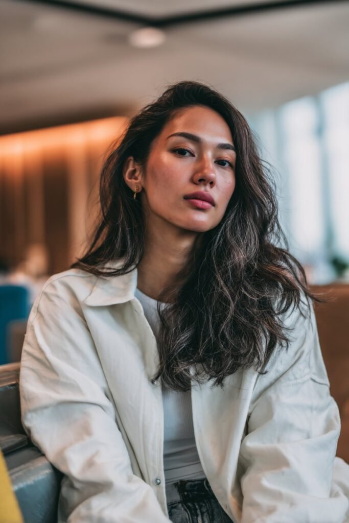 Woman wearing espresso lowlights for rich gray dimension.