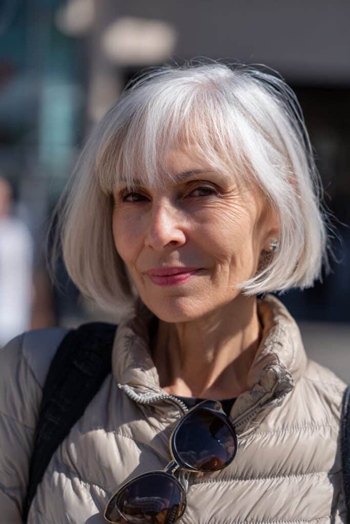 Disconnected bob short haircut for older women with fine hair and dimension.