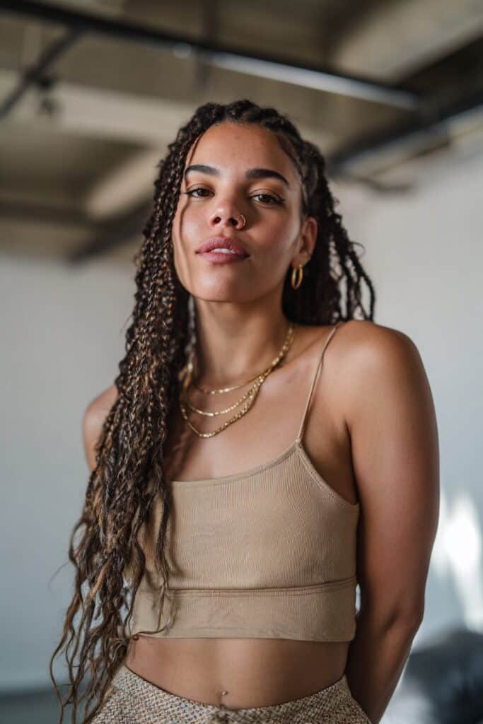 Woman with long cassie braids styled straight and sleek.