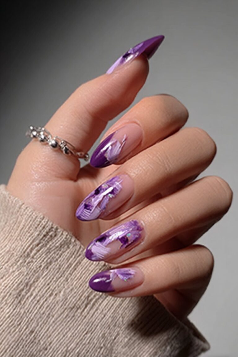 Almond nails with glossy amethyst base and abstract lavender brushstrokes.