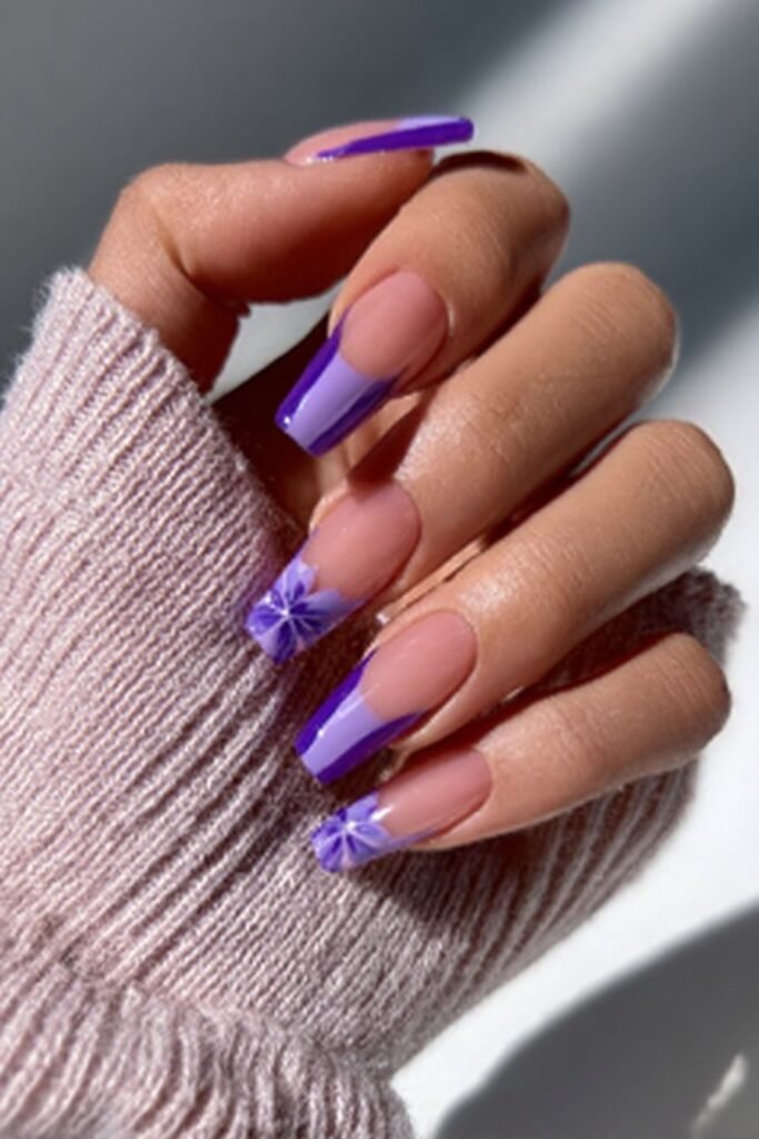 Glossy manicure with bold amethyst purple French tips.