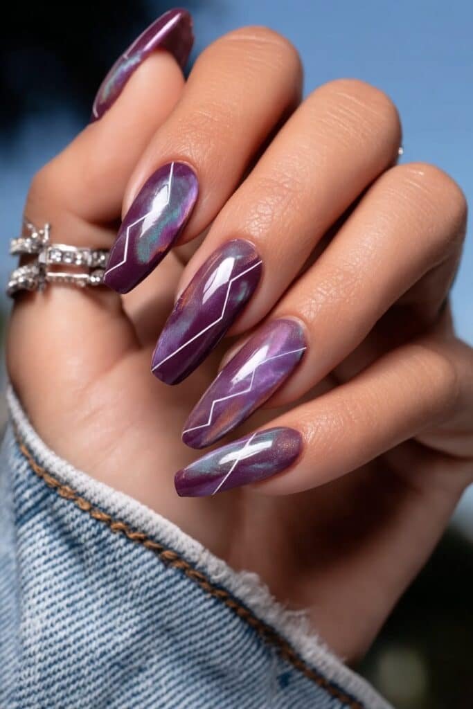 Coffin-shaped amethyst nails with modern silver geometric lines.