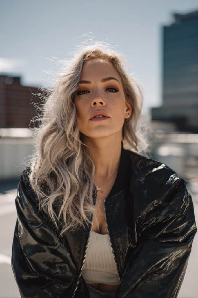 Dirty blonde hair with platinum blonde tips fading into bright ends