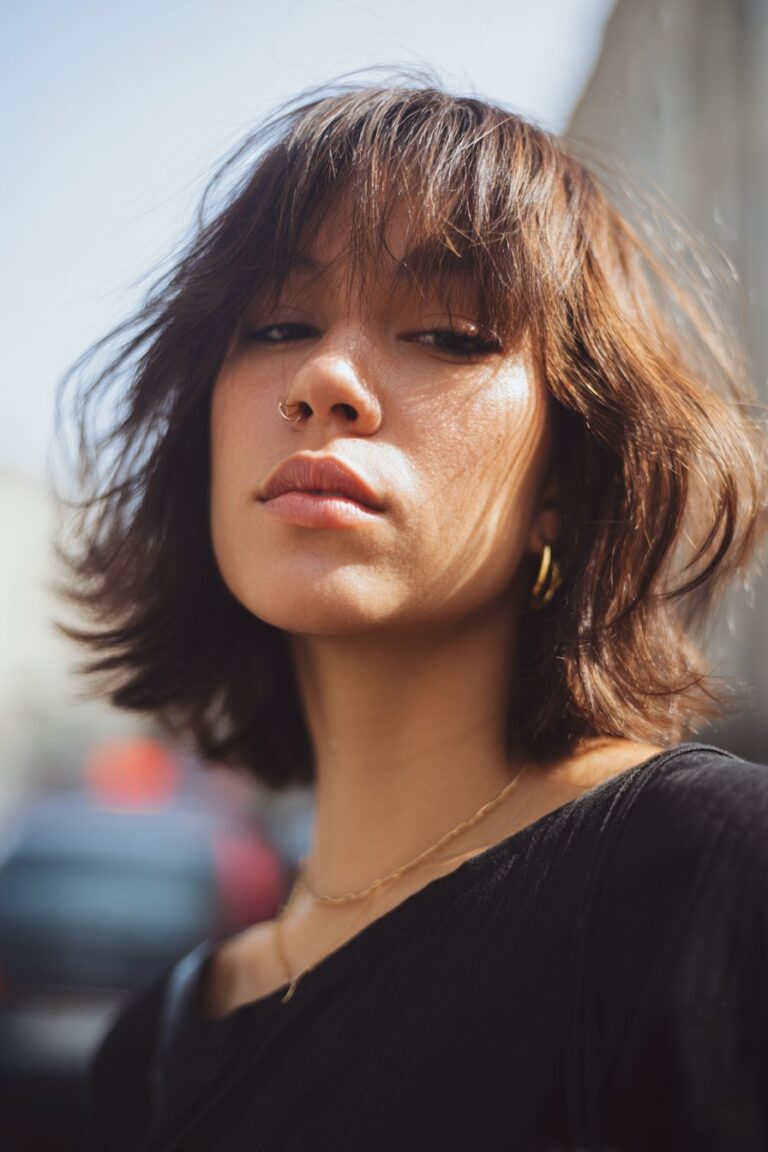 woman with razored lob and piecey bangs