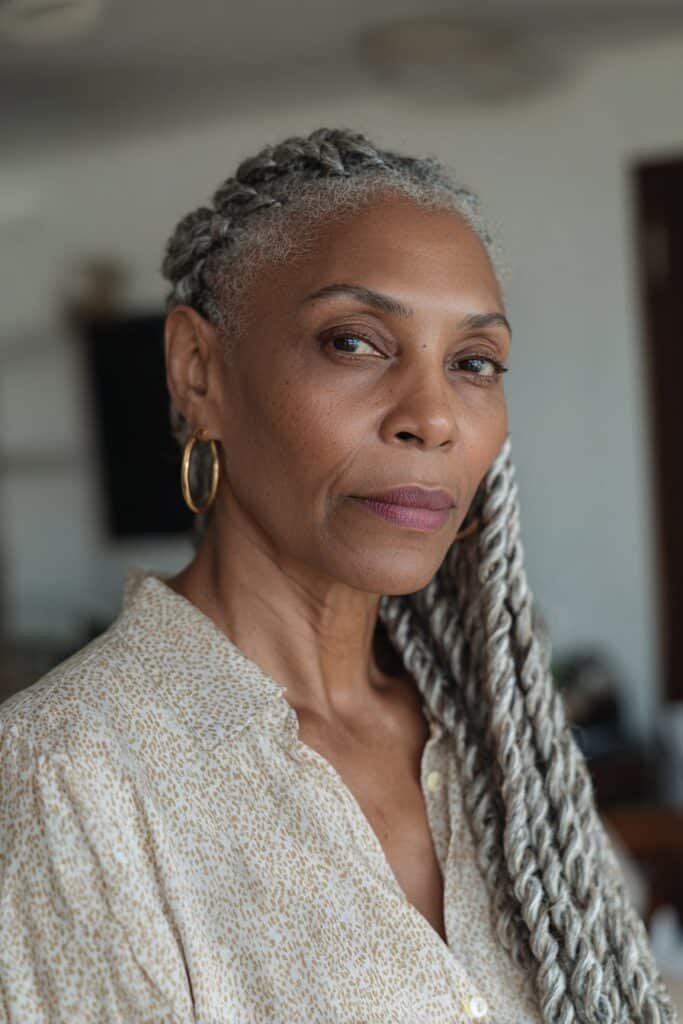 Older Black woman with Senegalese twists in a smooth rope-like style