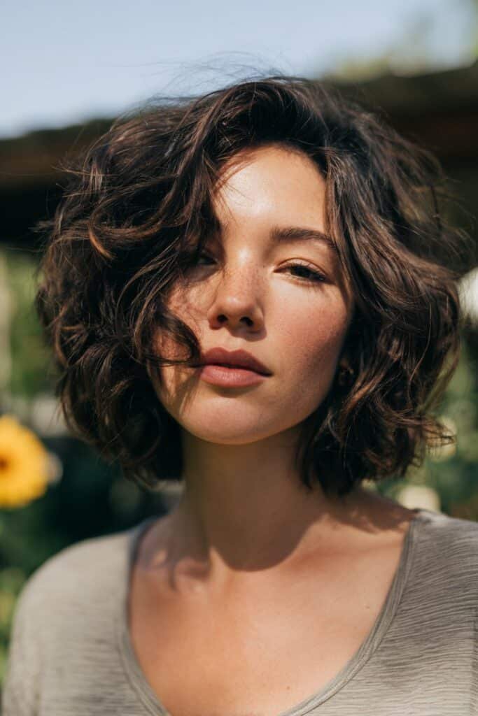 Modern shag layered haircut for wavy hair with tousled texture