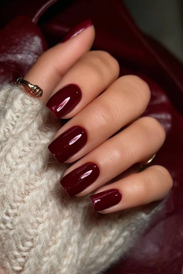 Deep burgundy square nails with rich glossy finish.