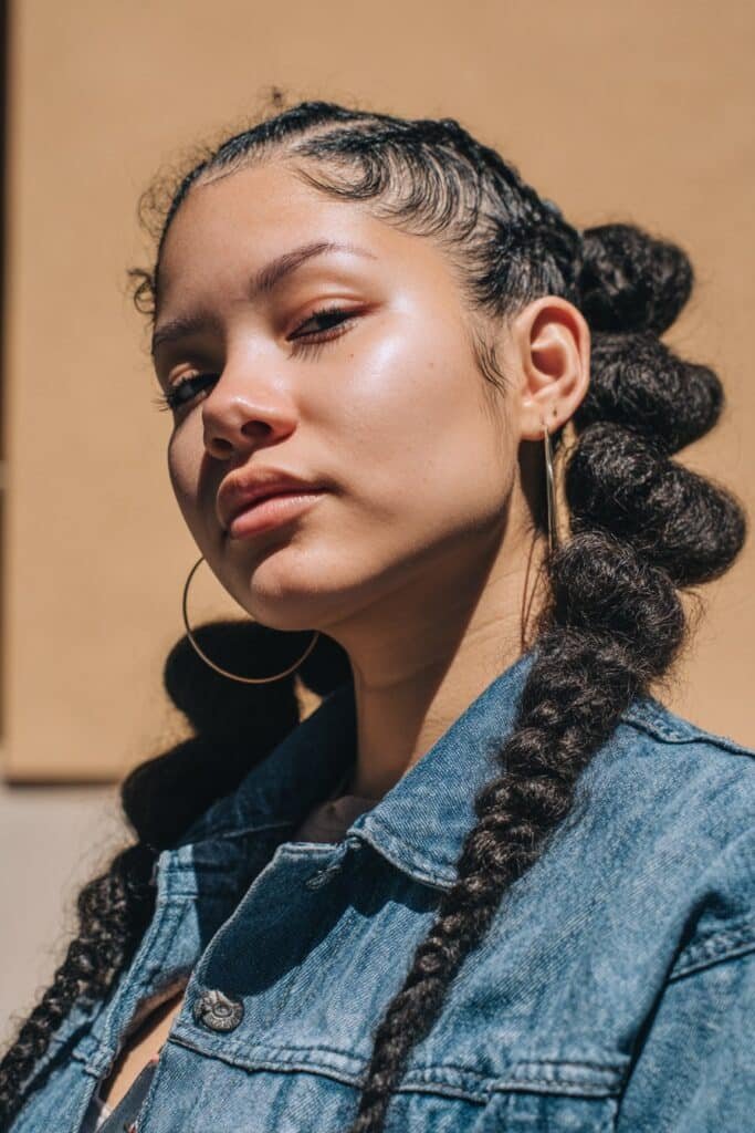 woman with bubble braid ponytail hairstyle, braided base and puffed bubbles