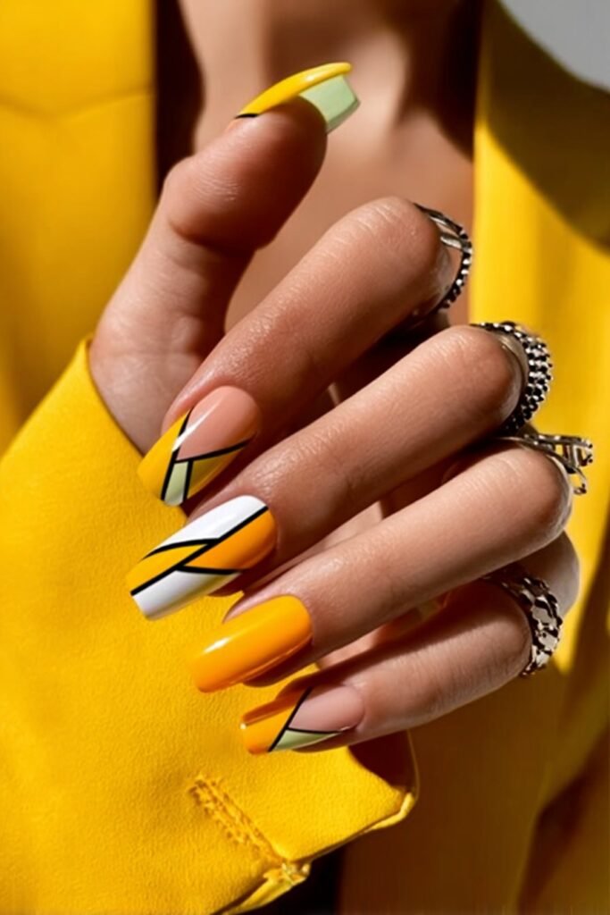 Modern geometric nails in lemon yellow with clean abstract patterns.