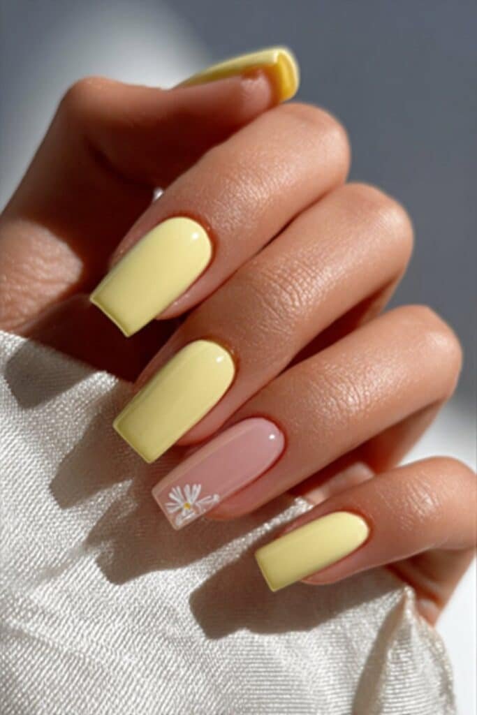 Bright lemon yellow square nails with clean glossy finish.