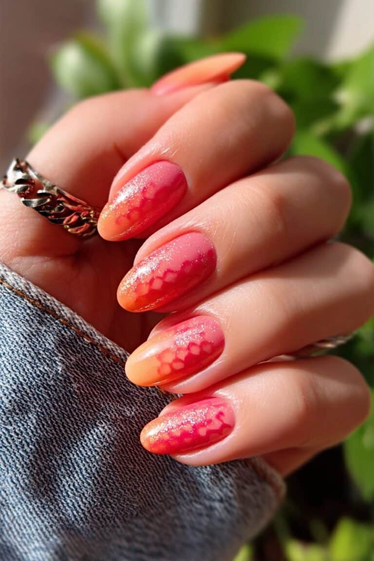 Pastel ombre nails blending orange, lavender, and mustard shades.