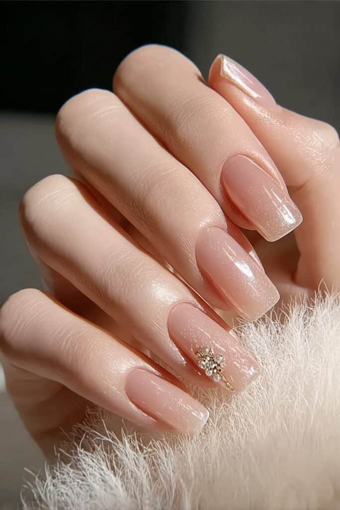 Square nails with soft pearl shimmer and glossy finish.
