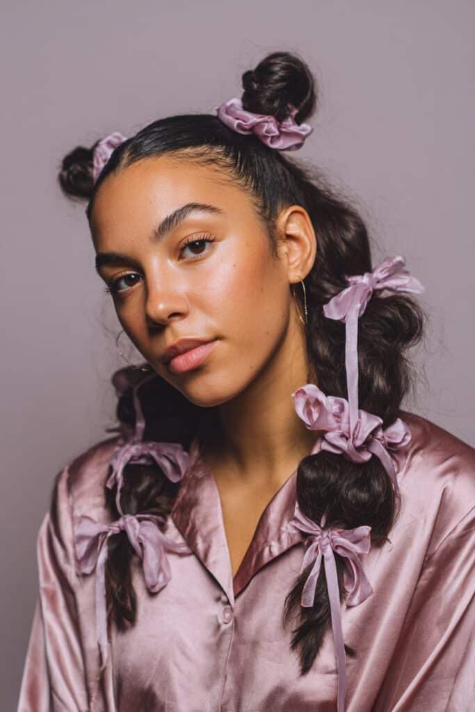 bubble ponytail wrapped with satin ribbons on long hair