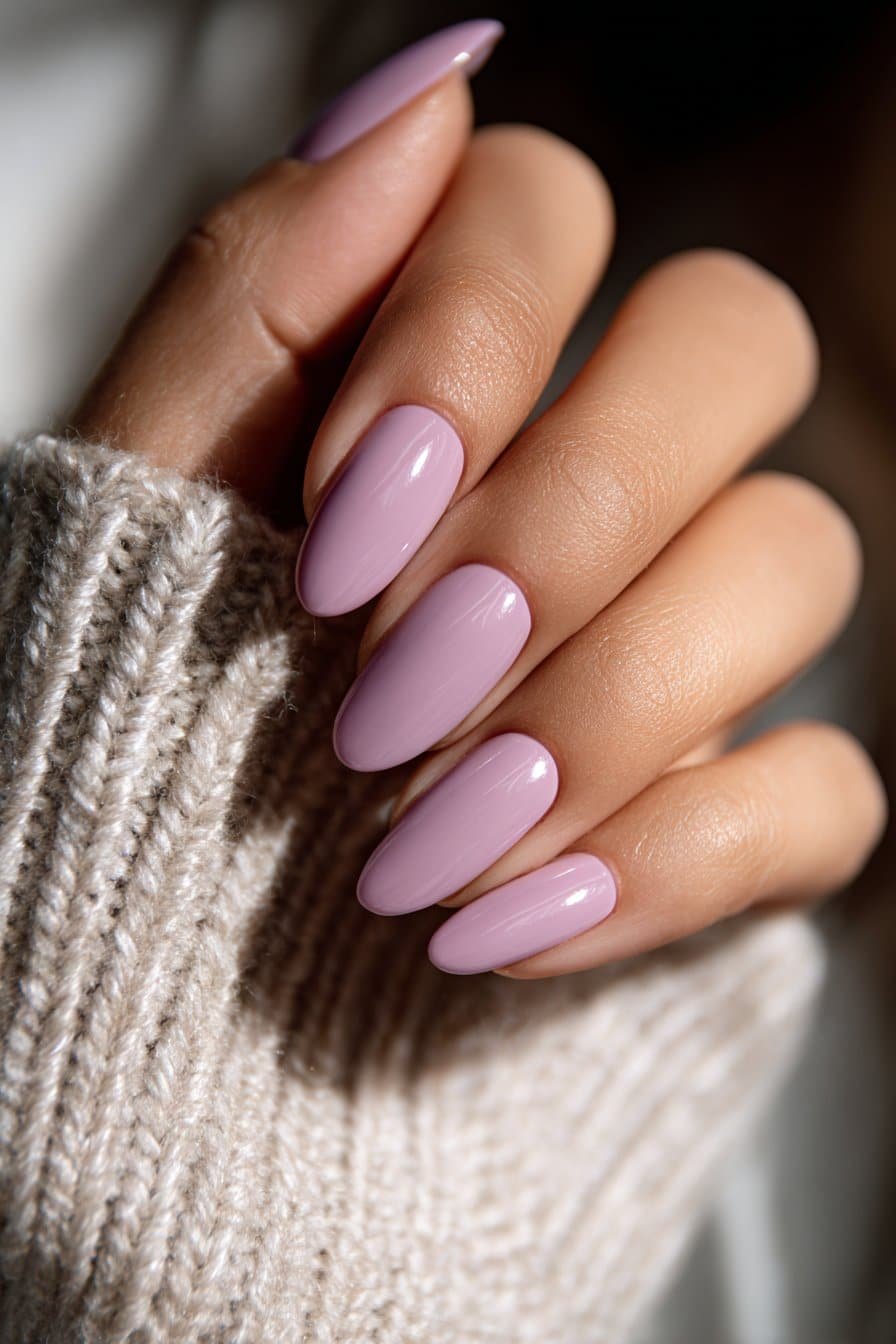 Soft lavender nails with smooth glossy finish.