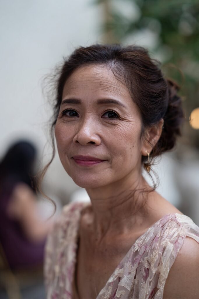 older woman with modern twisted updo for elegant wedding style