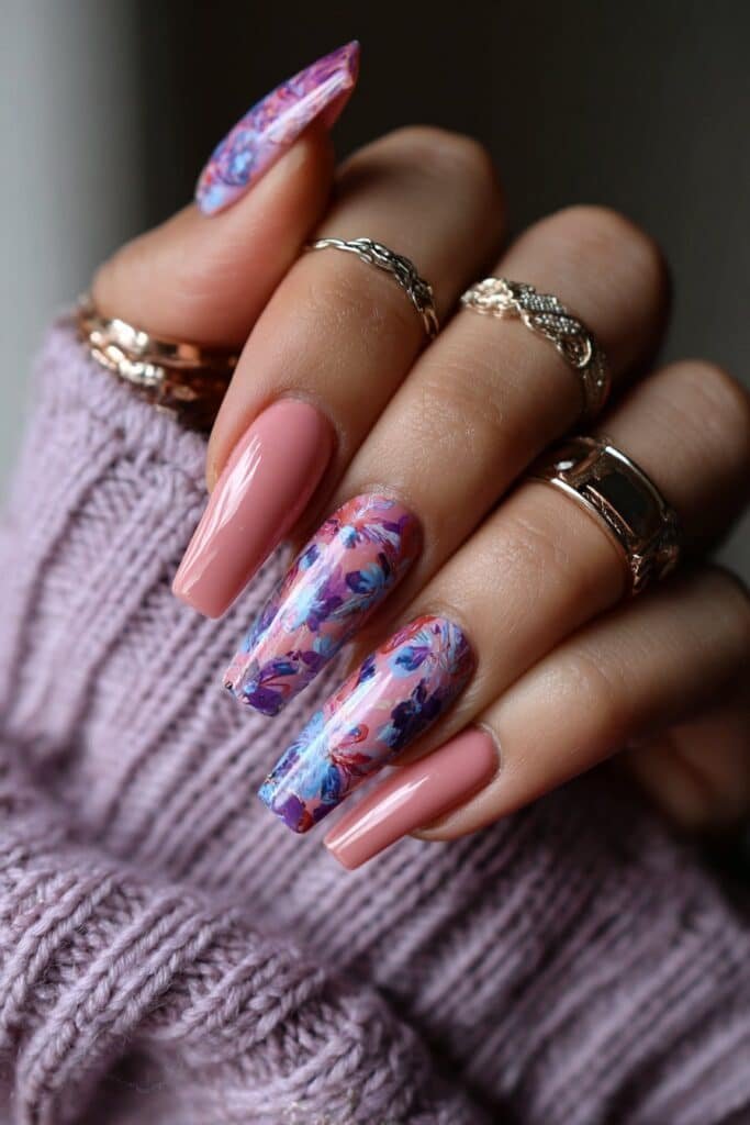 Watercolor nails with blended floral patterns in pastel shades.