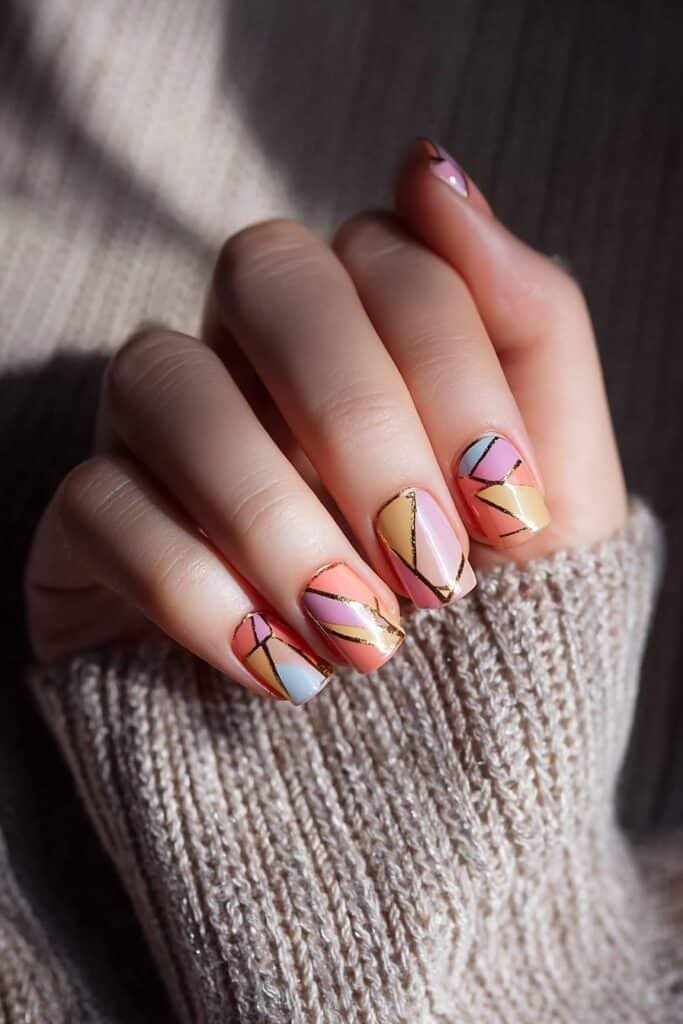 Square nails with bold abstract geometric summer patterns.