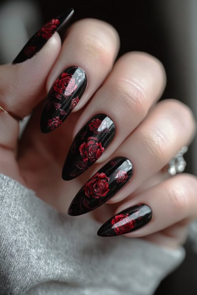 Black nails with deep crimson rose bloom designs.