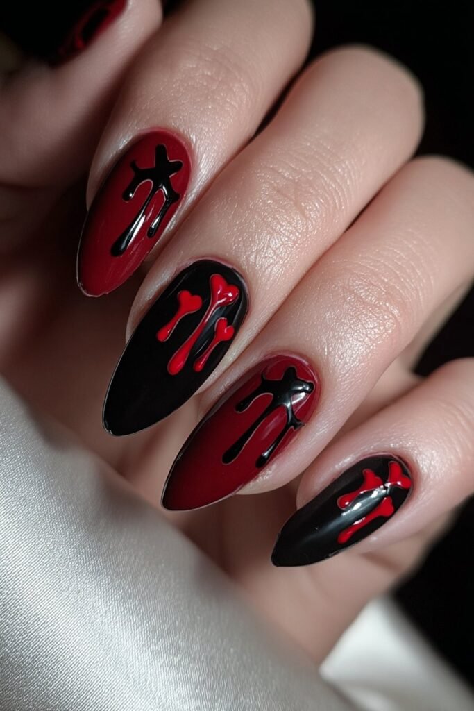 Black and red nails with dripping heart designs.