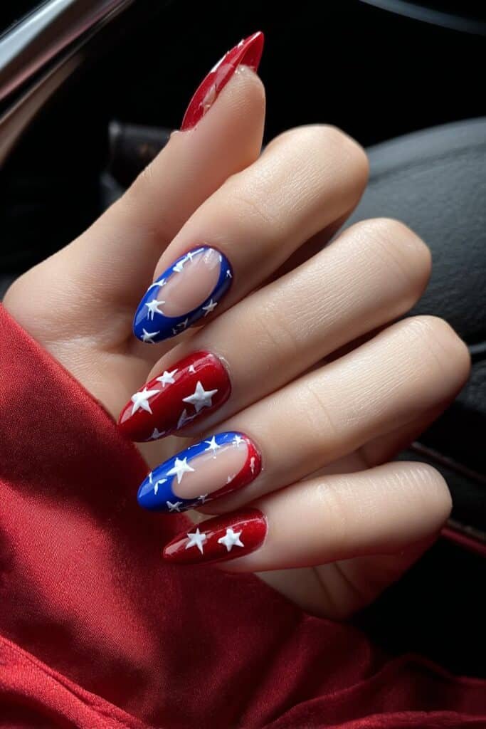 Bold patriotic nails with white stars on red and blue base.