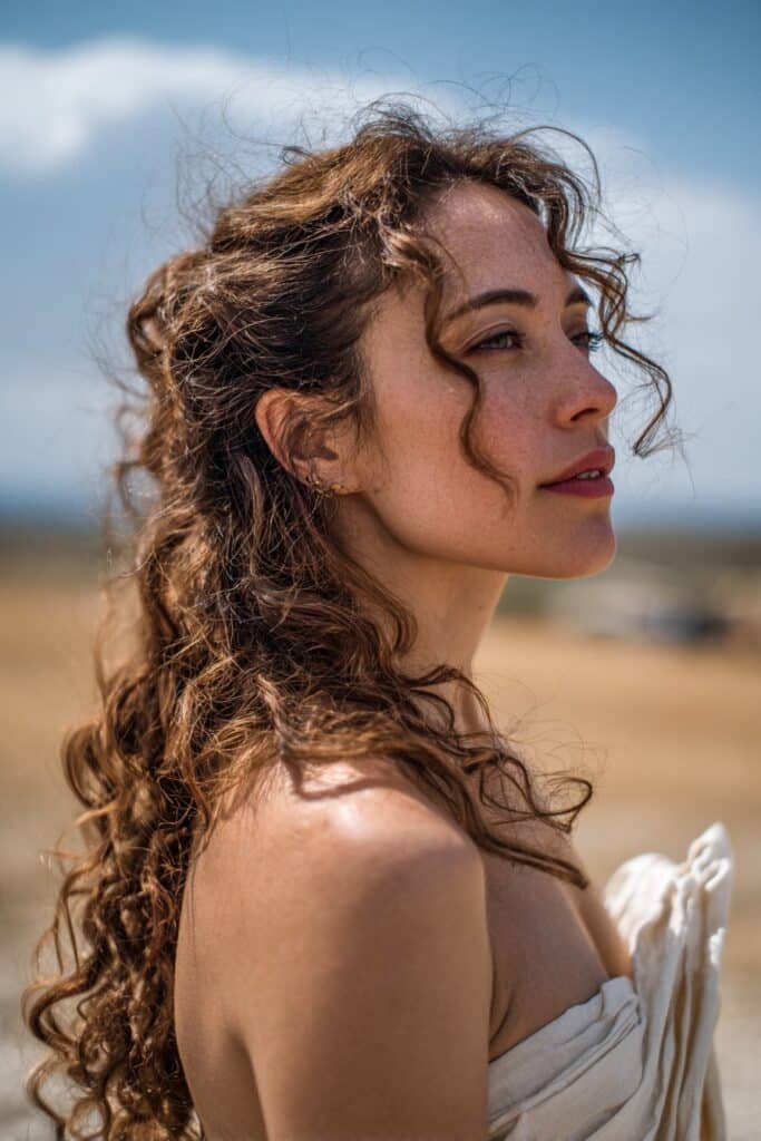 woman with ringlet curls hairstyle, cascading curls