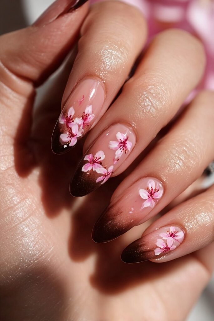 Cherry blossom nails with soft pink ombre background.