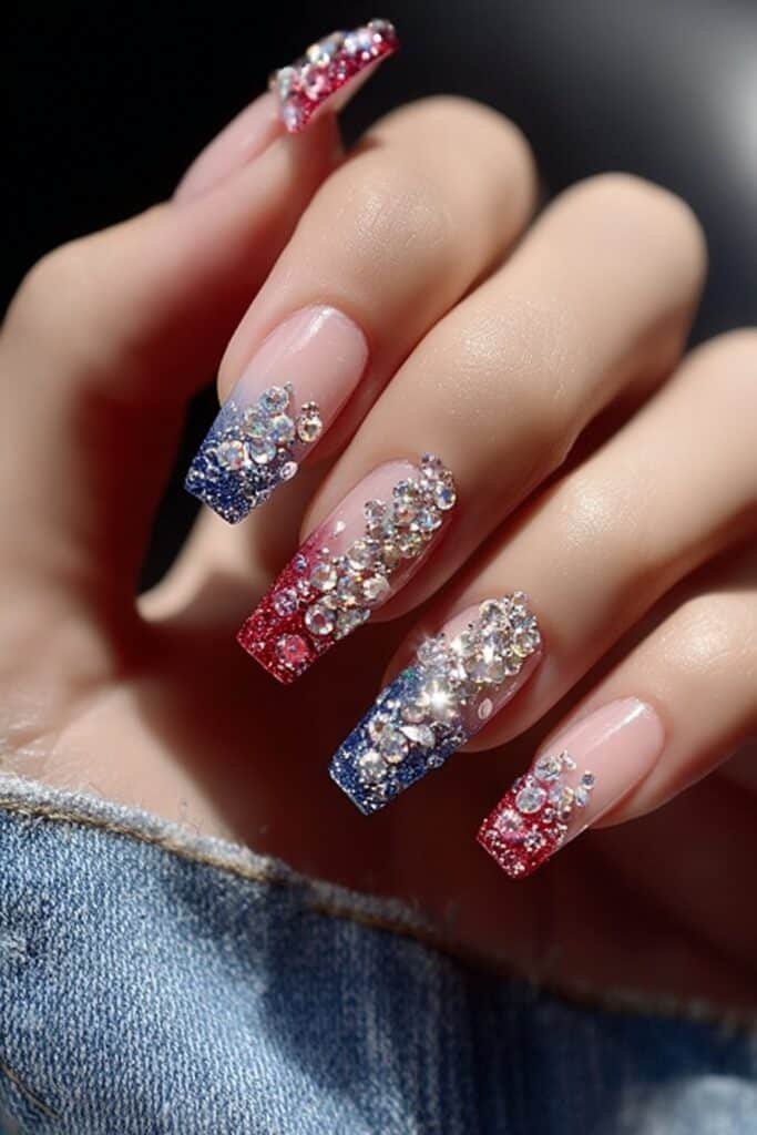 Patriotic nails with sparkling crystals and rhinestone accents.