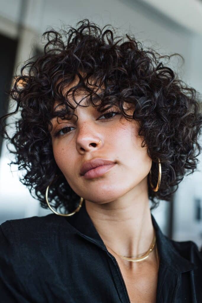woman with curly bob hairstyle, short defined ringlets