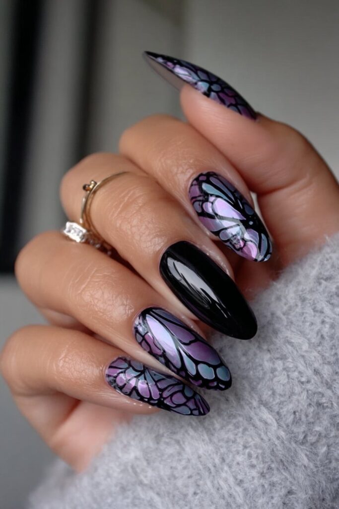 Black and purple nails with detailed butterfly wing patterns.