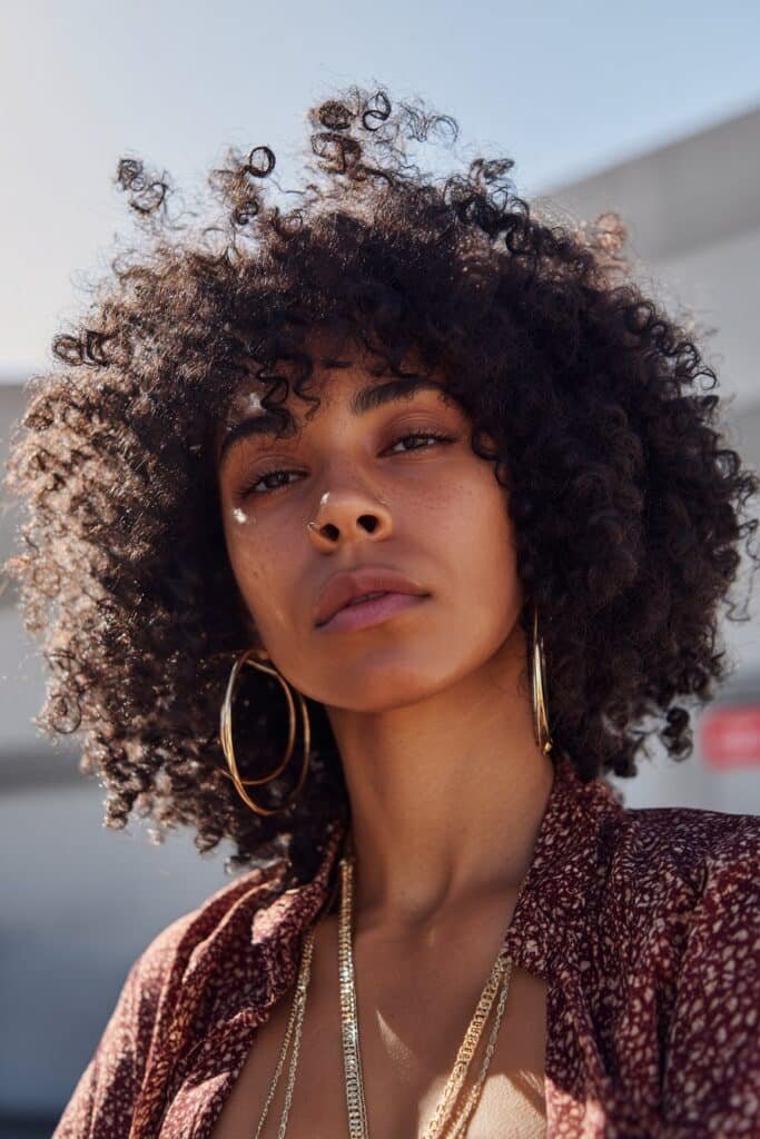 woman with defined twist-out curls, textured natural hairstyle