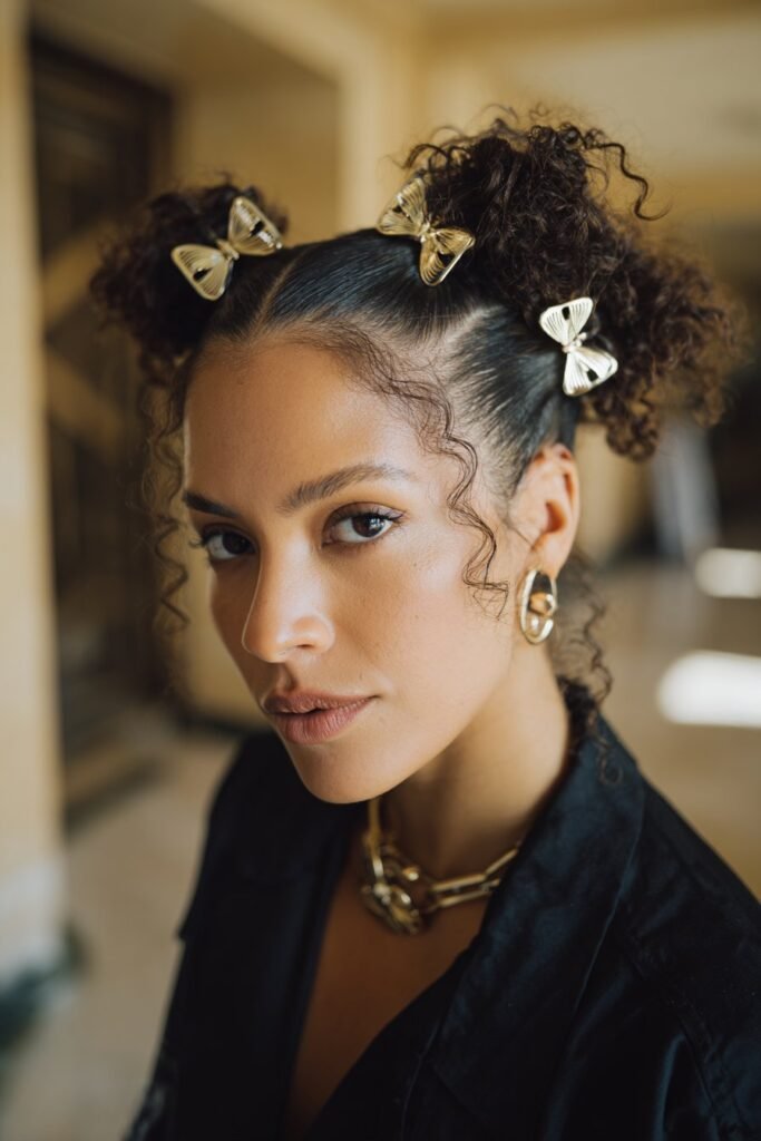 woman with double french twist hairstyle and metallic butterfly clips
