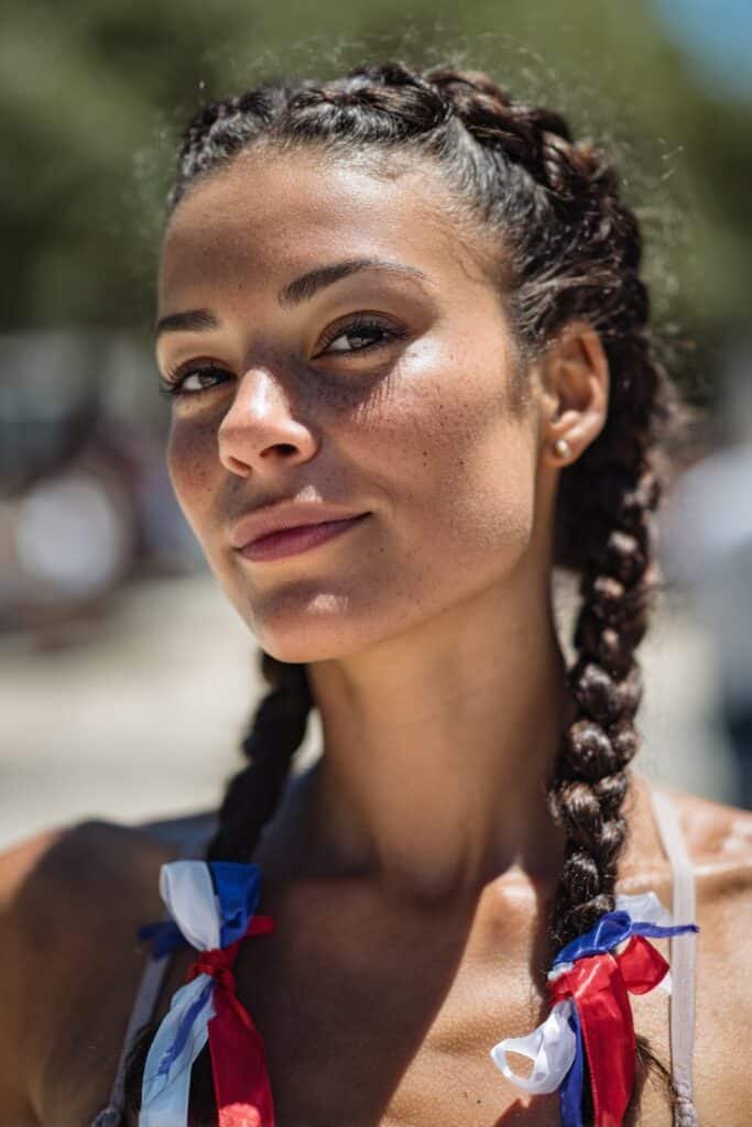 woman with french braid and patriotic ribbon woven hairstyle