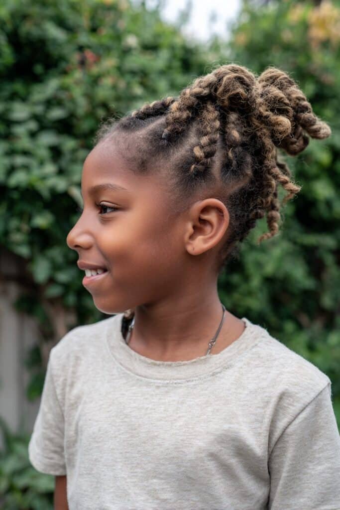 girl with ghana braids hairstyle, thick feed-in braids